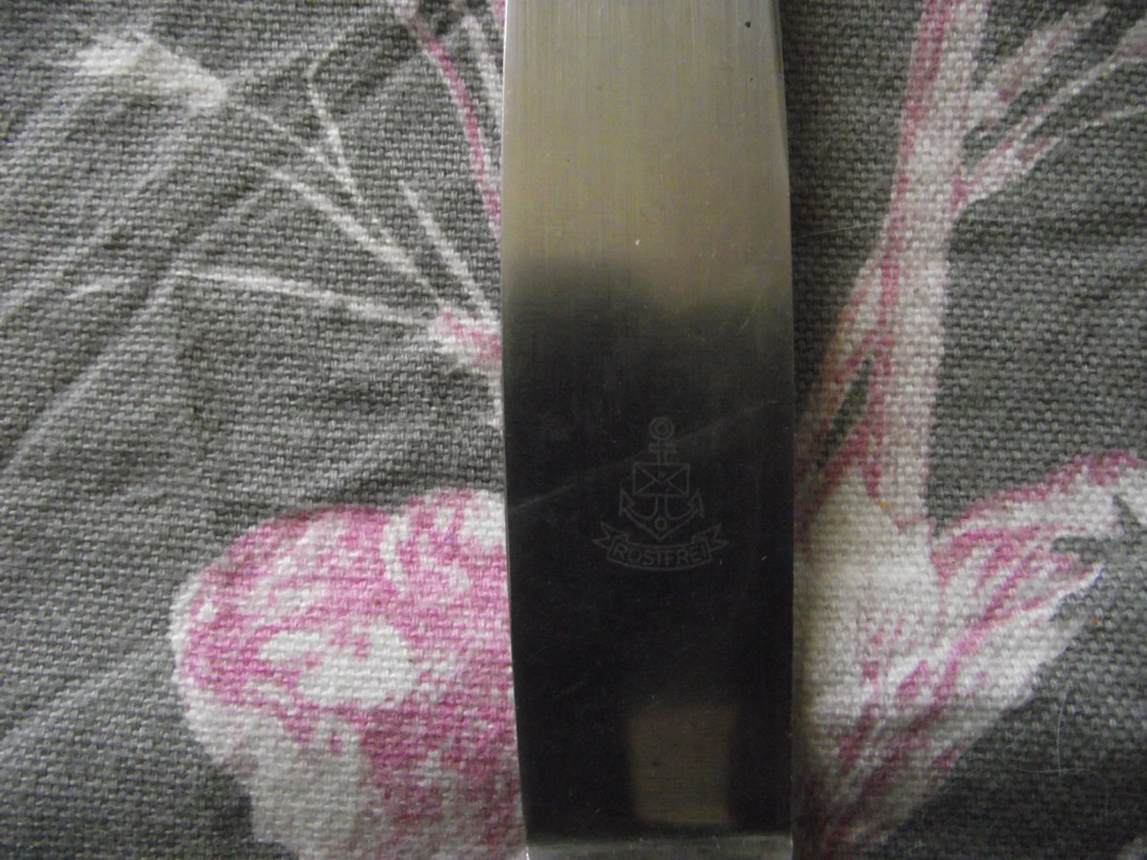 12 silver metal table knives from ROSTFREI