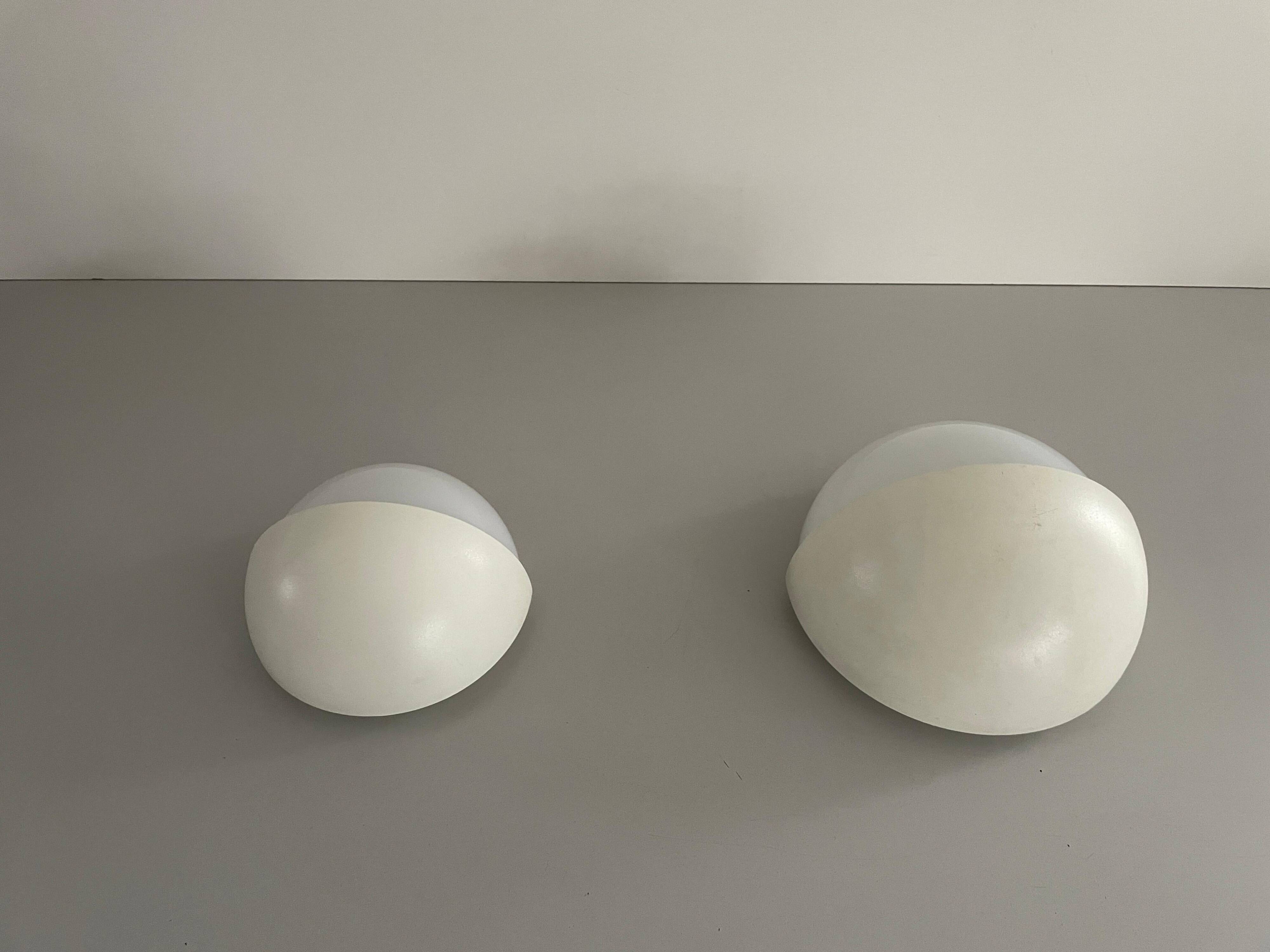 Round wall lights, small and large, in white metal by Bega, 1970s, Germany.