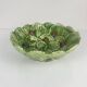 Leaf and strawberry-shaped bowl/strainer.