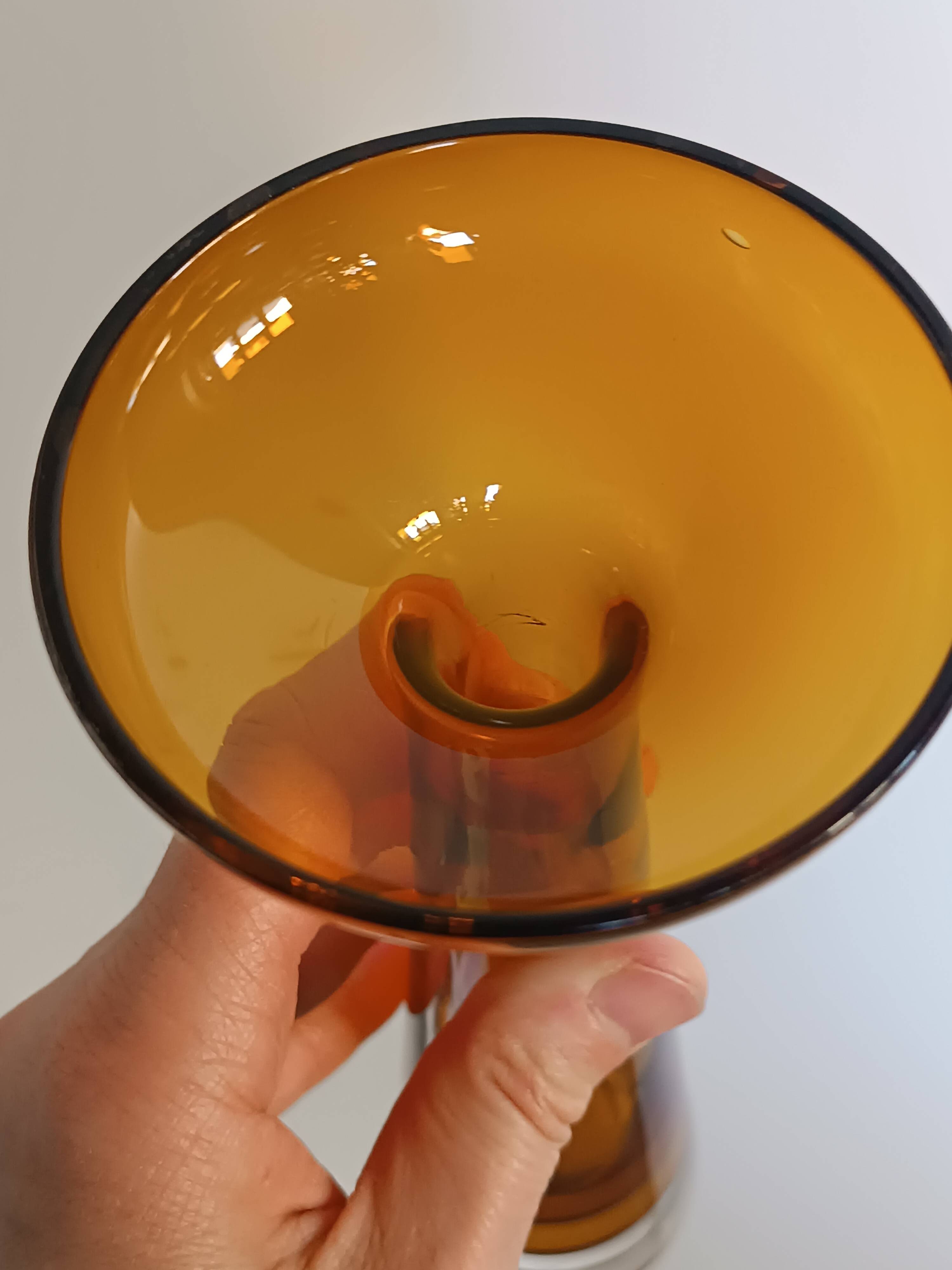 Two vintage Scandinavian double-layered amber blown glass candlesticks