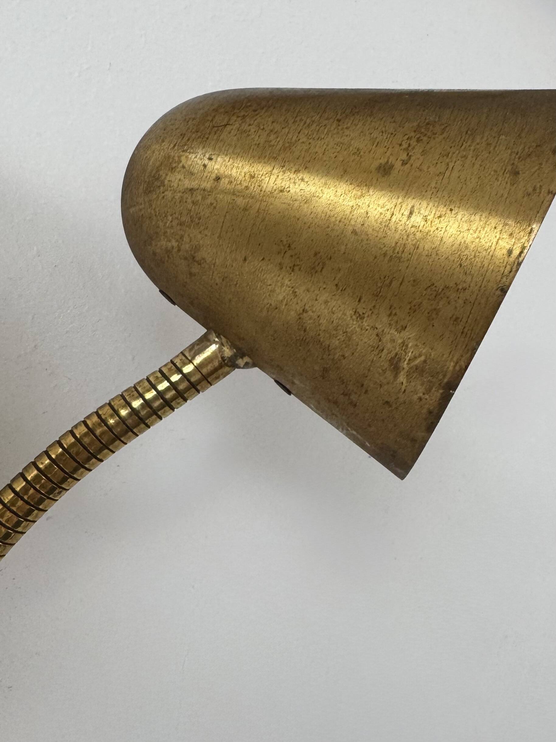 Double orientable vintage patinated brass wall light, Jacques Biny France 1950.