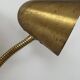 Double orientable vintage patinated brass wall light, Jacques Biny France 1950.