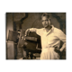 Photograph of an Indian director leaning on his camera