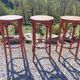 3 wooden bar stools with caning