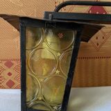 Pretty iron and glass lantern In very good condition black iron color of yellow glass relief circ