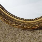 Louis XVI style golden medallion mirror, 63x41 cm