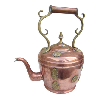 Oriental copper kettle with brass patterns