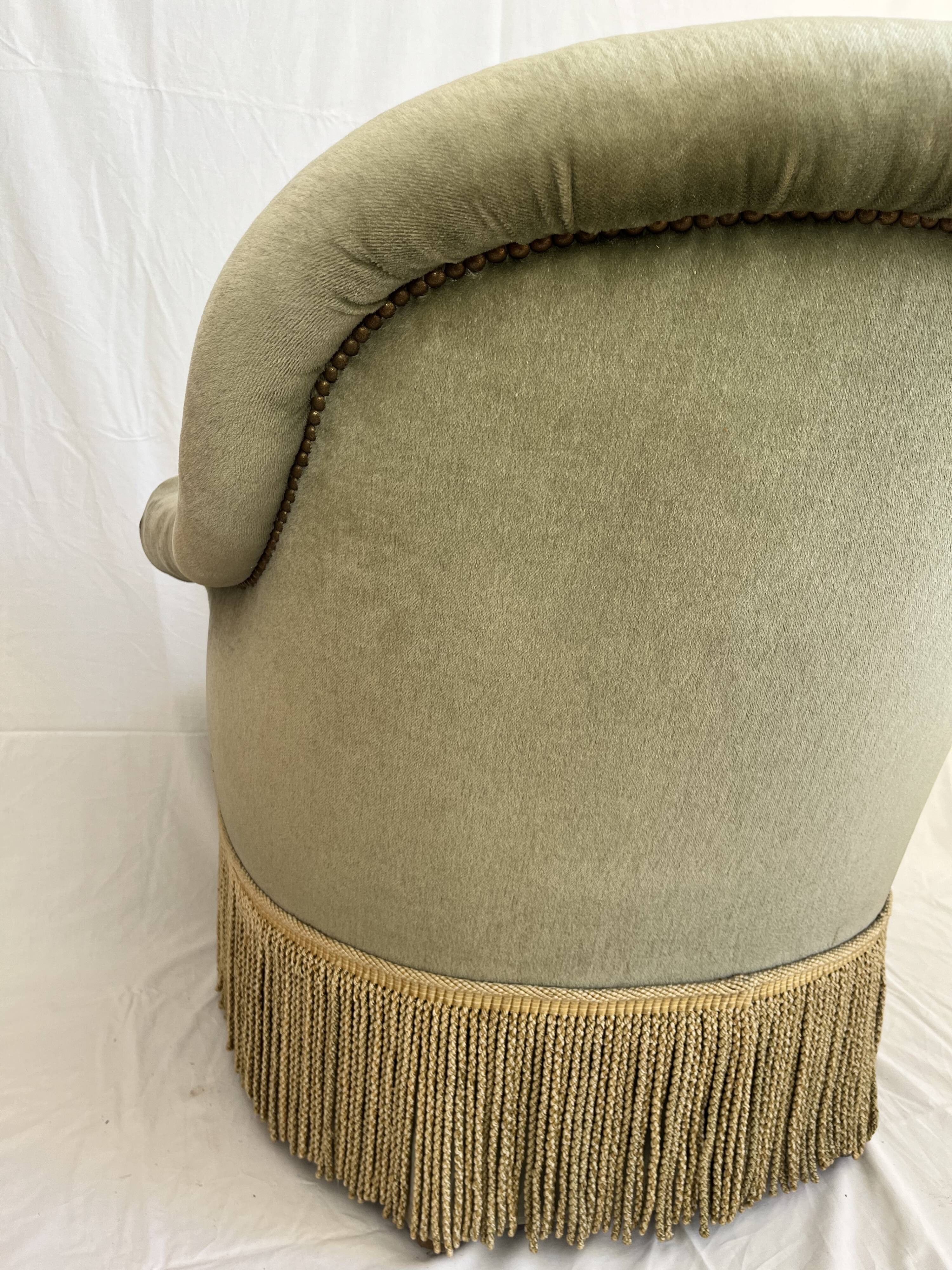 sage green toad armchairs with gold fringe