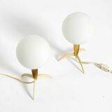 Two Mid-Century Modern rocket table lamps in brass and glass