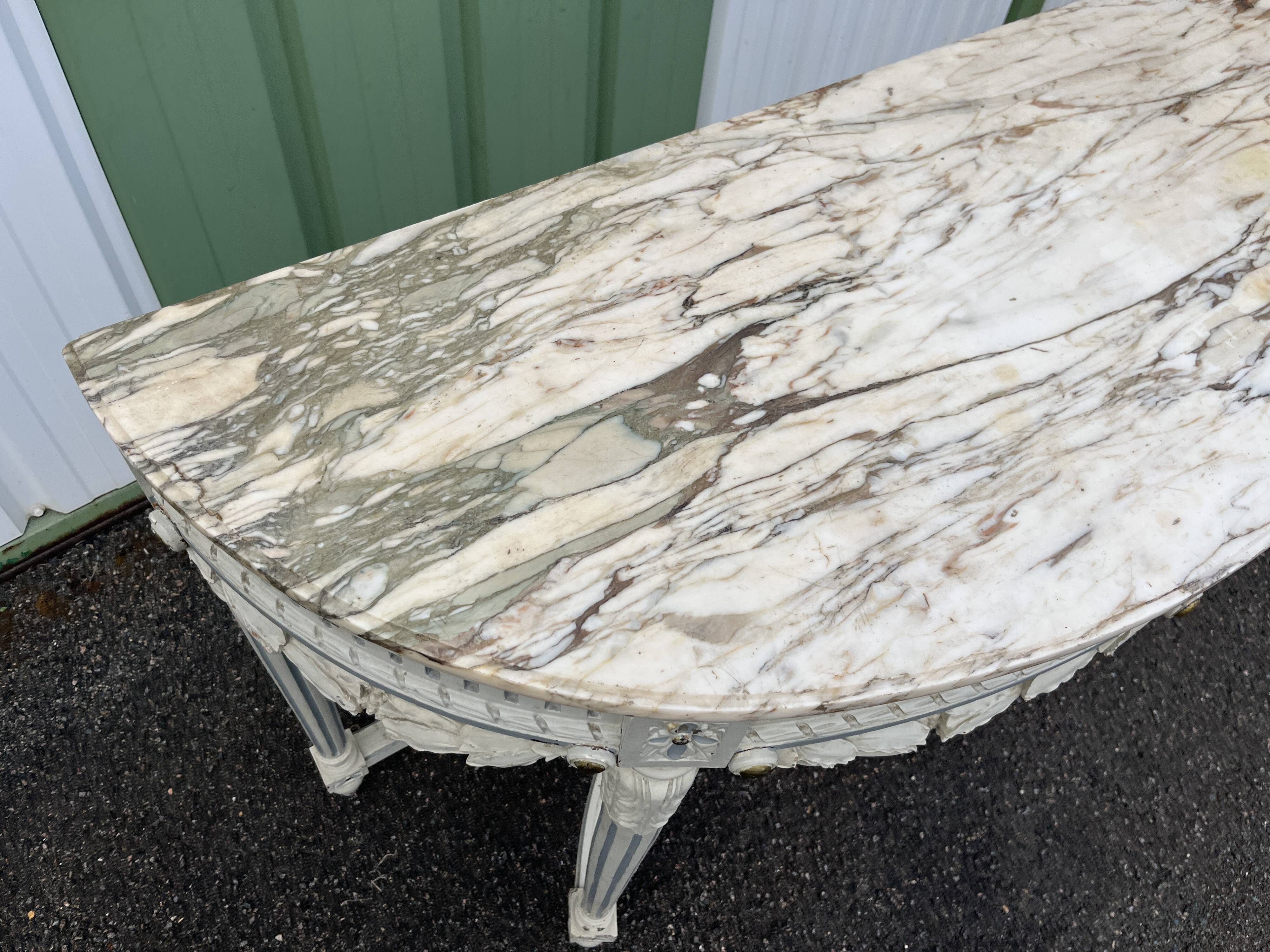 Louis XVI style half-moon console table with carved and painted wood and marble top