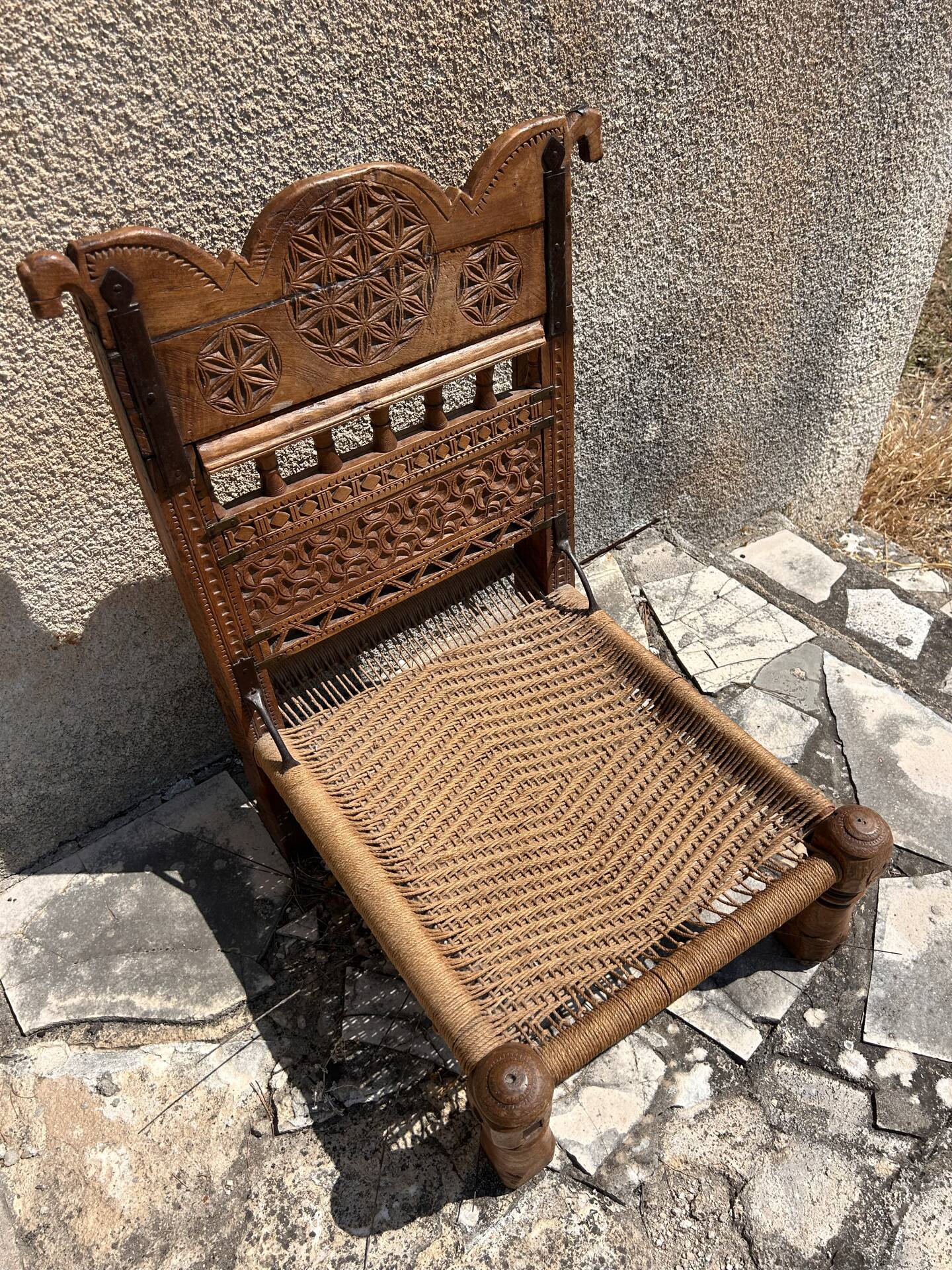 Antique ethnic chair in carved wood