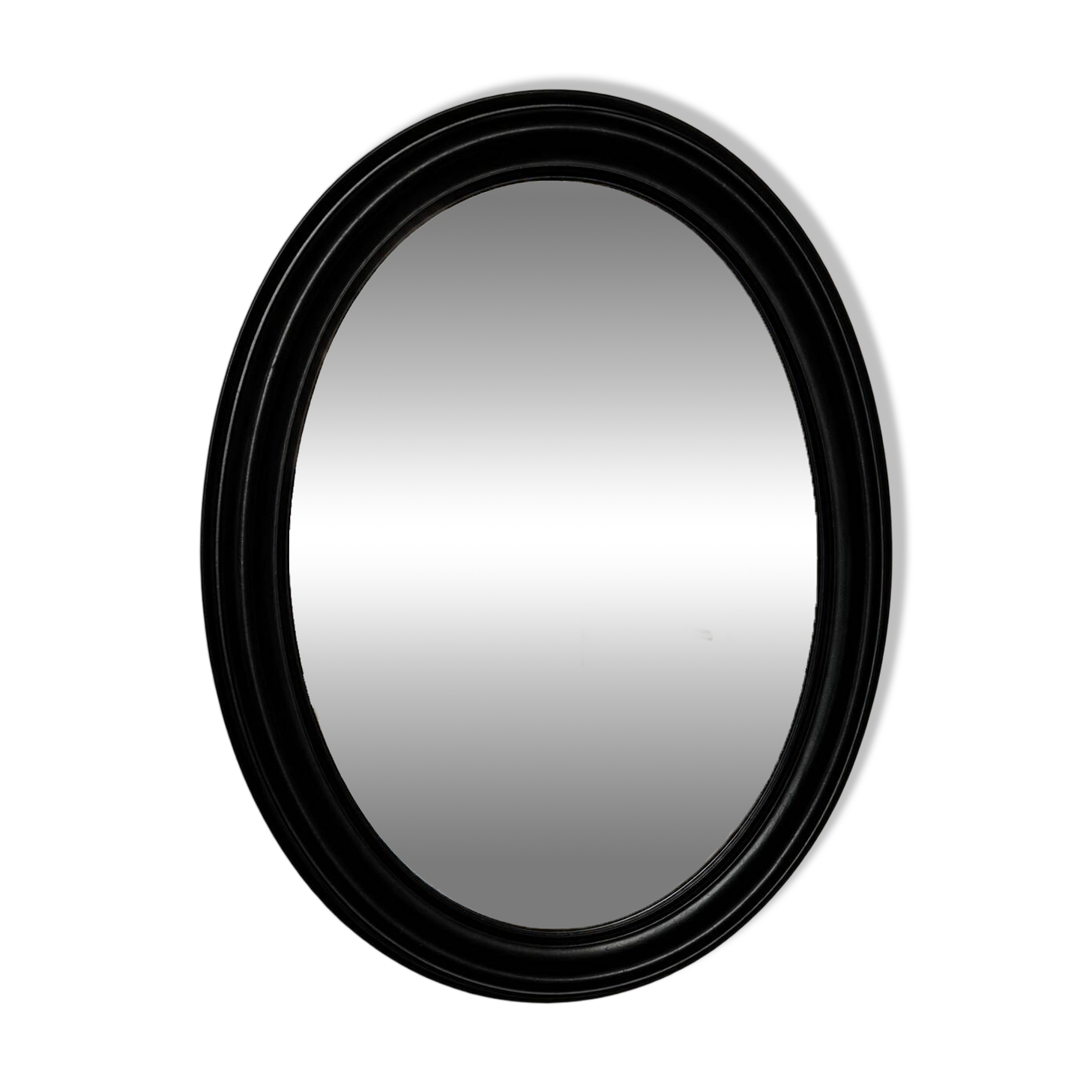 Antique oval mirror in patinated black wood