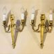 Louis XVI bronze wall sconces from the 19th century with quiver decorations.