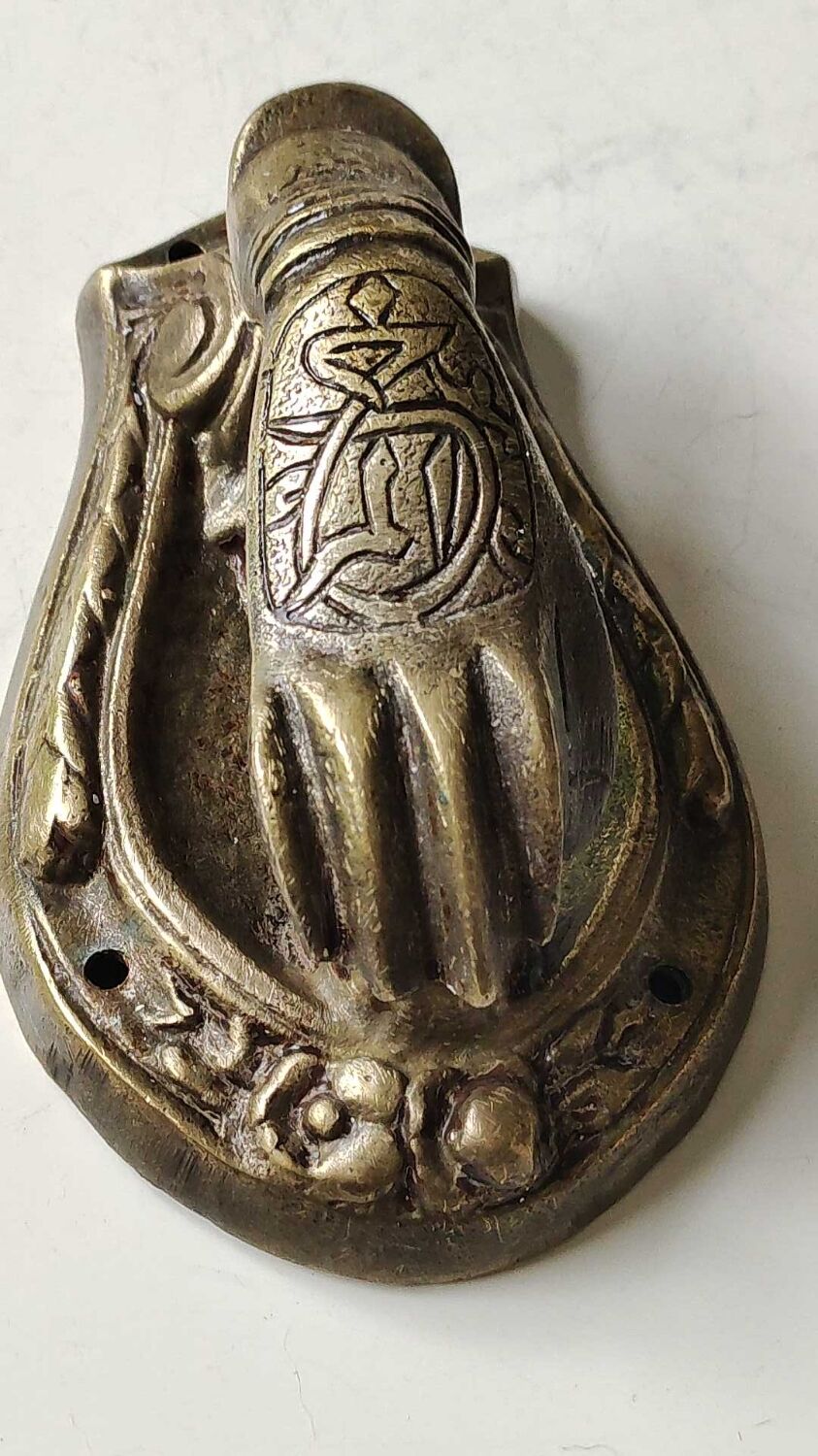Door knocker in bronze