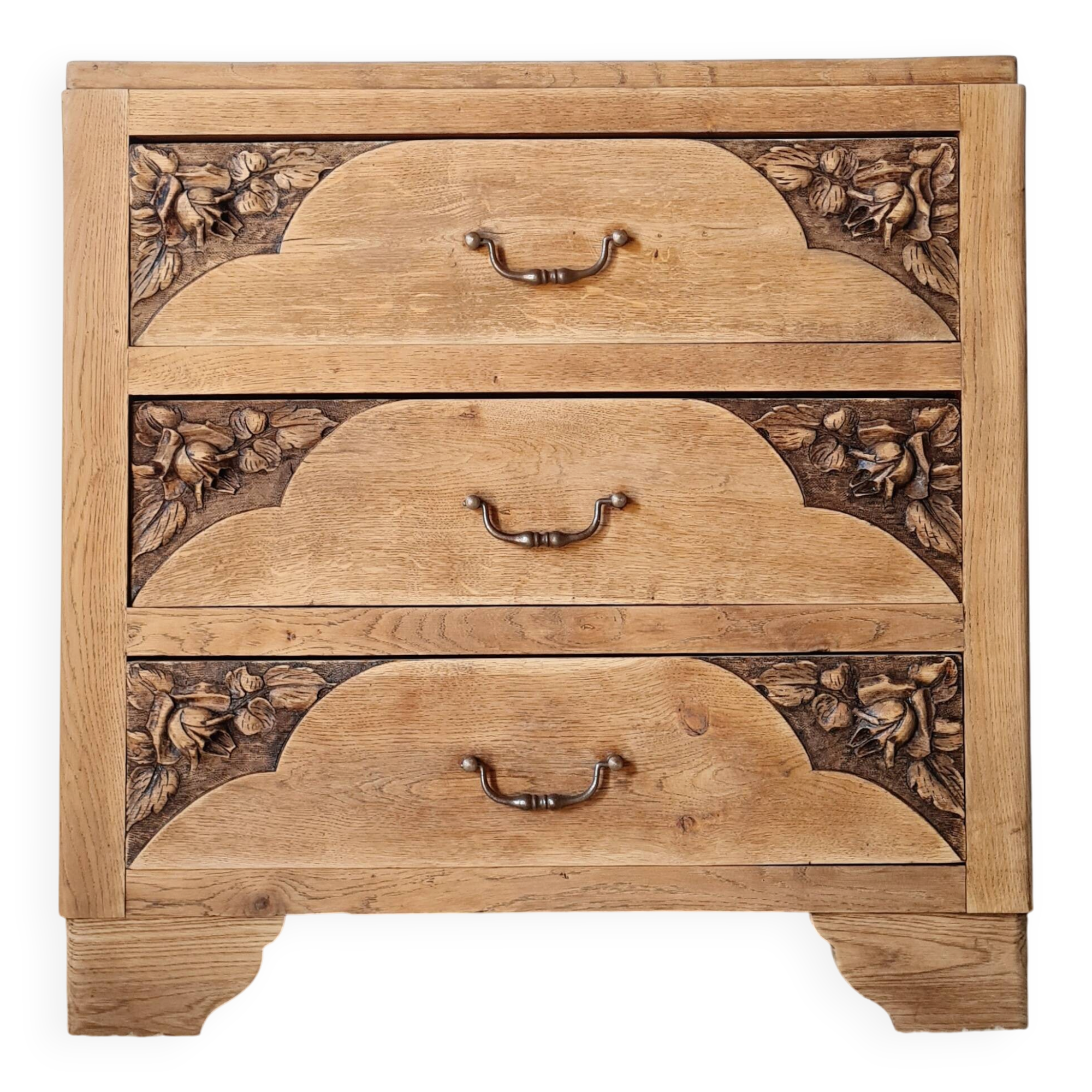 Art Deco chest of drawers in raw oak with carved drawers.