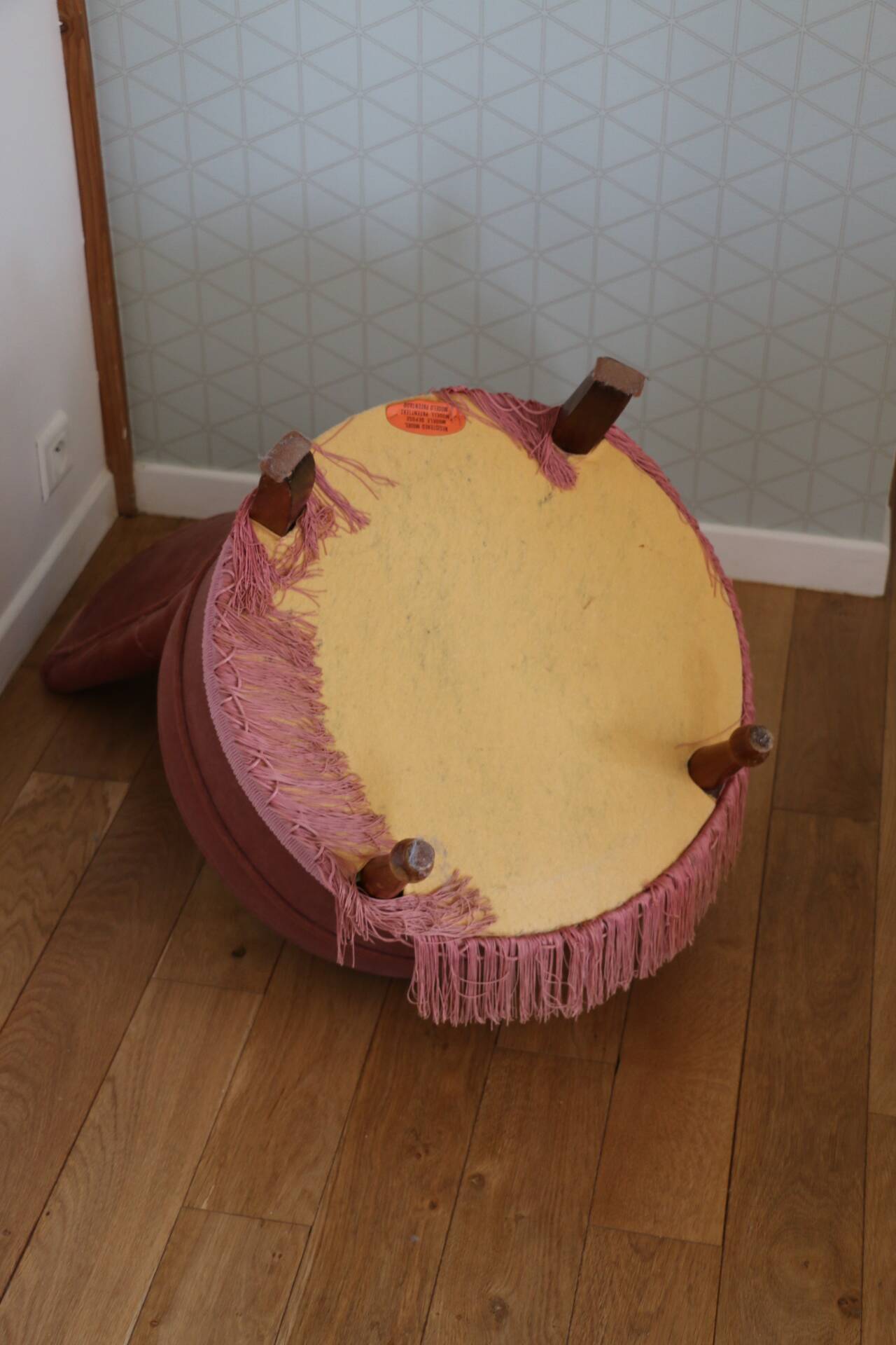 Powder pink fireside chair with fringes