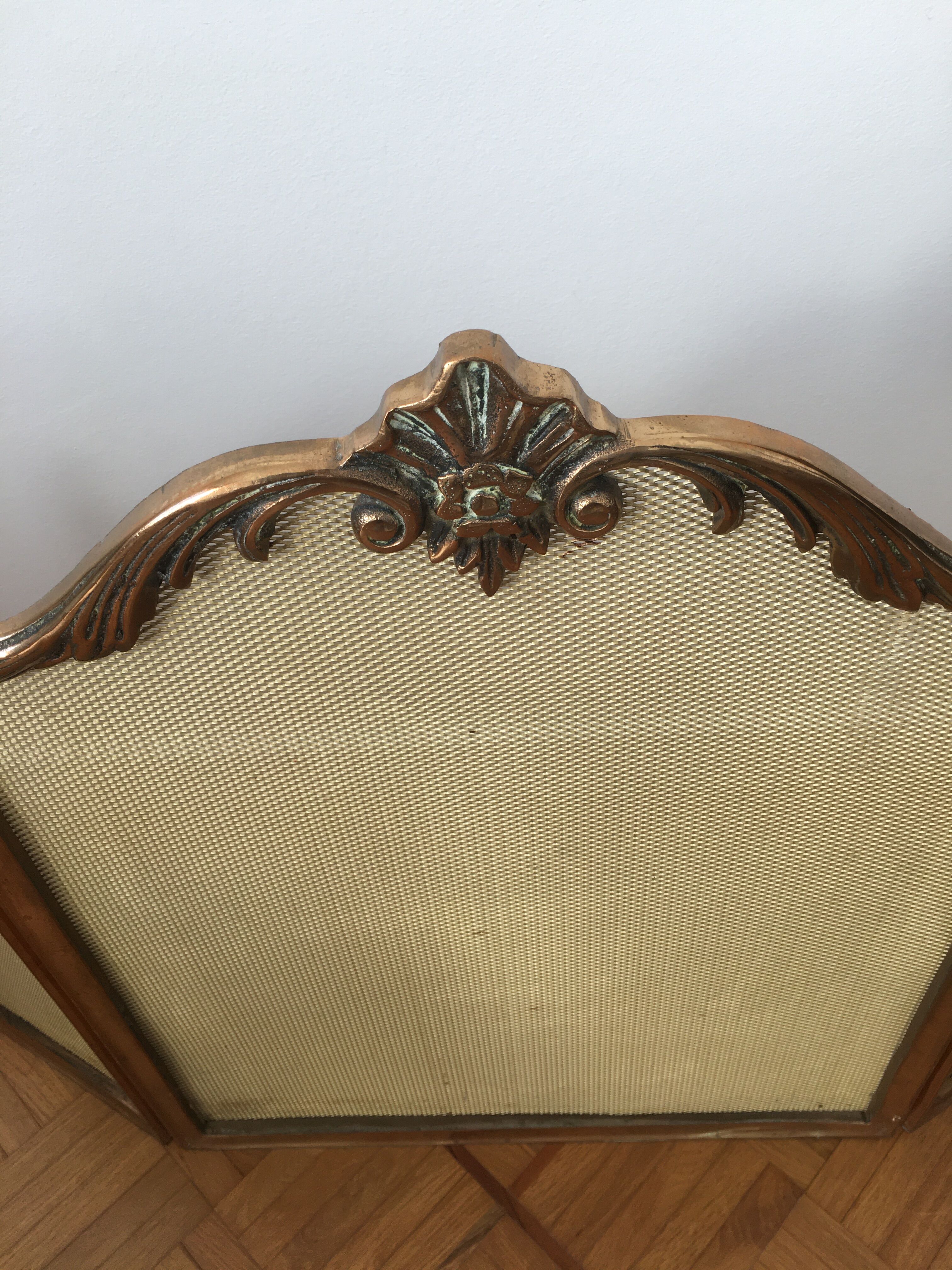 Copper-colored metal fireplace firewall