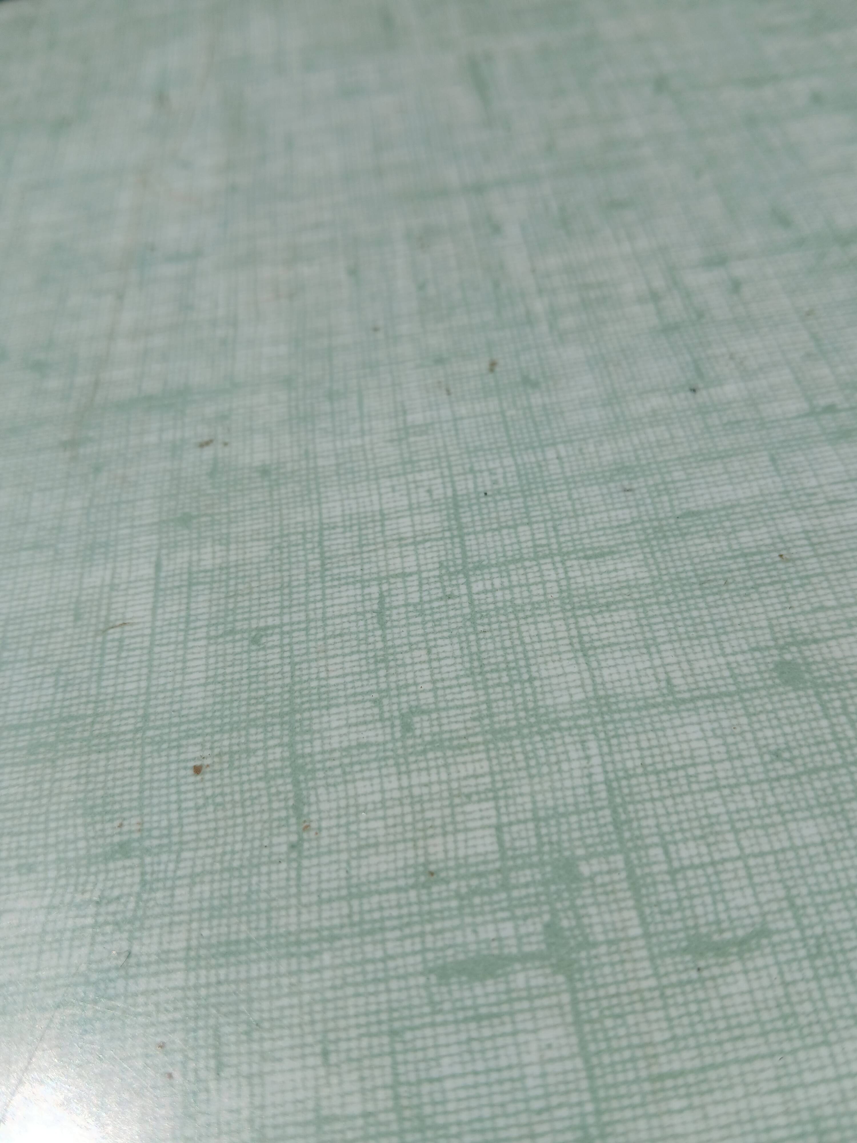 Shoe polish stool with round top and aluminum legs.