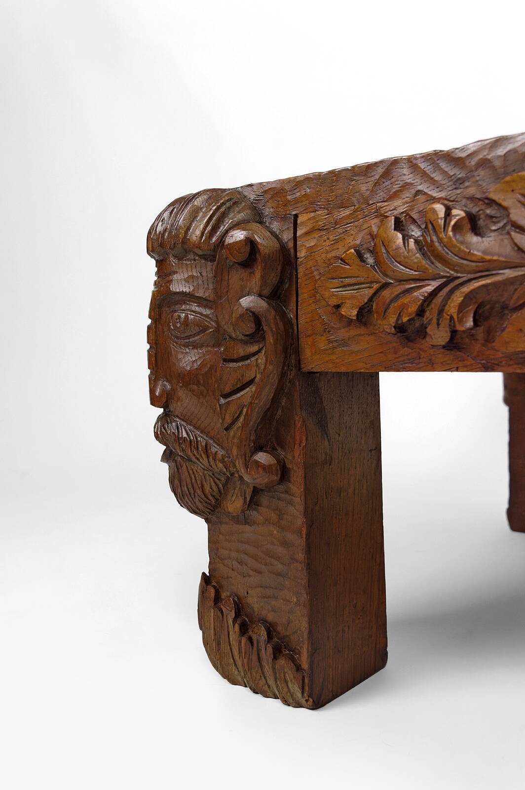Solid oak coffee table carved with fauns and gray marble top, France, circa 1940