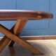 Vintage wooden coffee table with intersecting legs, France 1970
