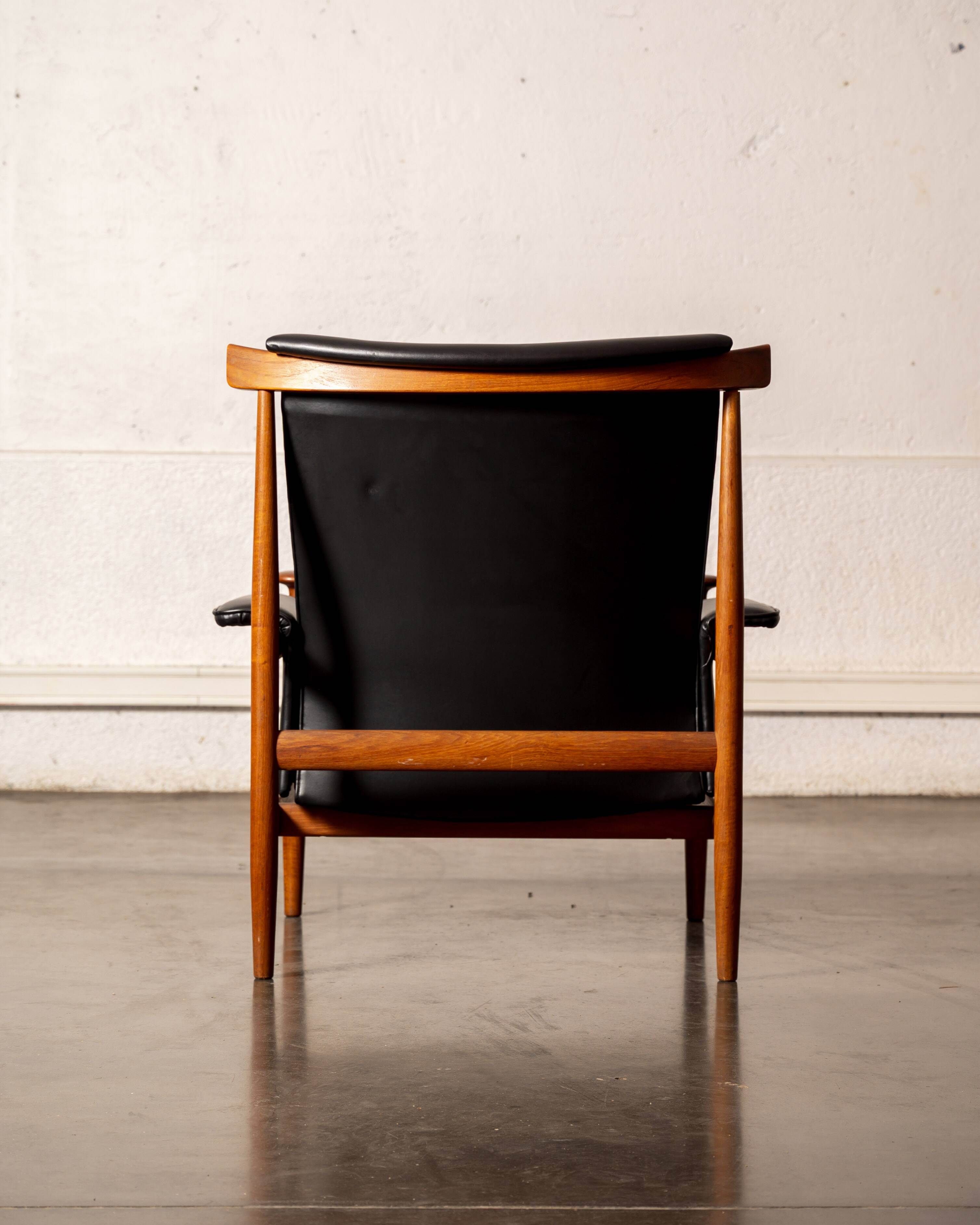 Finished Juhl armchair and its ottoman.