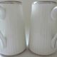 Pair of creamers in white porcelain enhanced with platinum