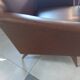 a pair of comfortable vintage armchairs with splayed legs