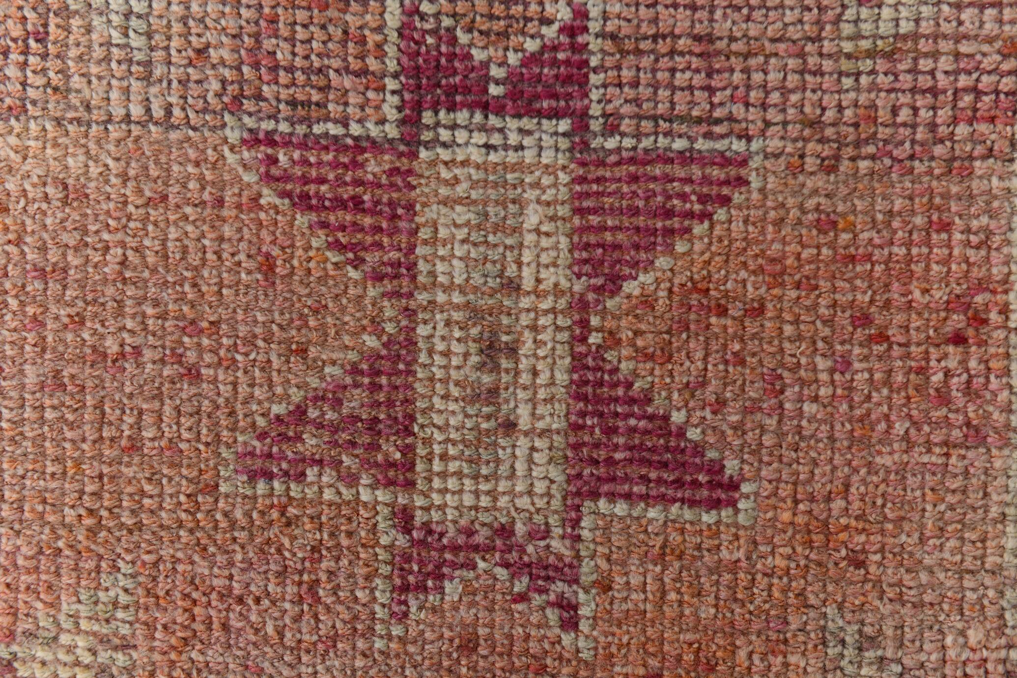 2x12 shades of pale orange vintage runner rug