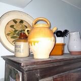 Old enameled ceramic pitcher