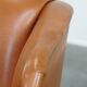 Fauteuil à oreilles en cuir de vache
