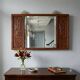 Antique mirror in exotic wood with chinoiserie carvings, 19th century.