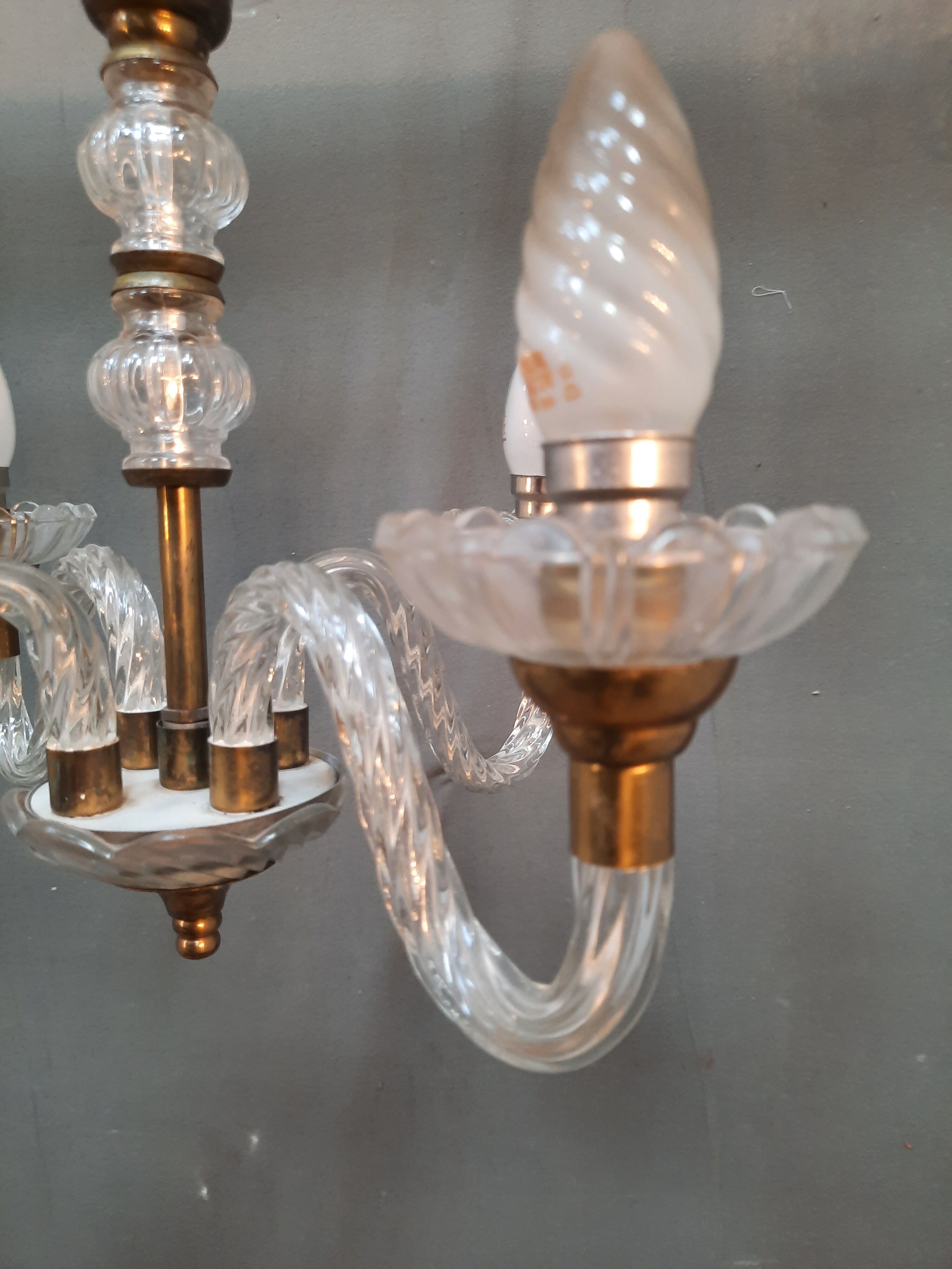 Glass chandelier has 4 lights