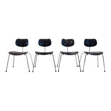 Set of four Egon Eiermann model SE 68 chairs in black lacquered plywood and steel.