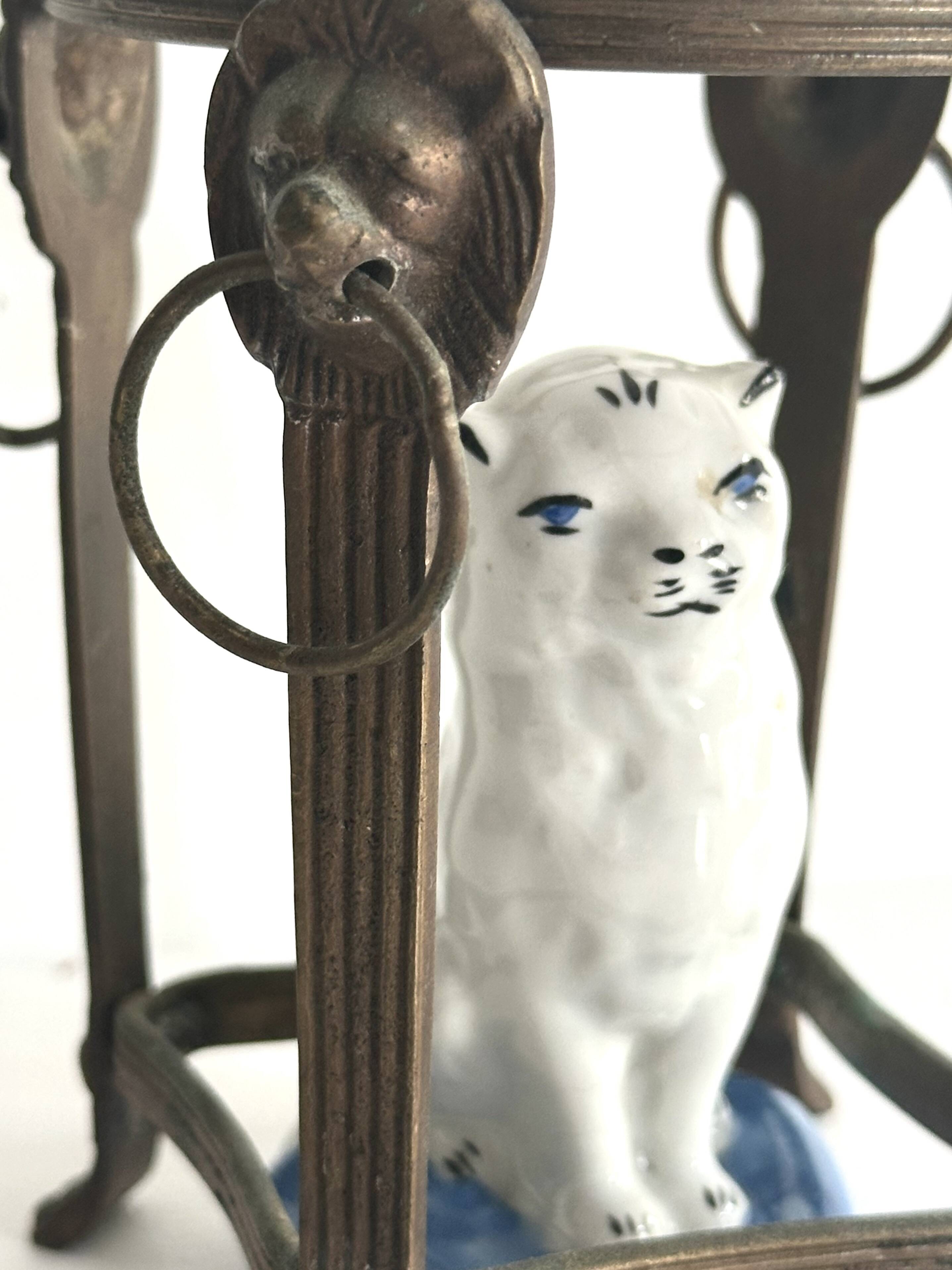 Small ancient glazed ceramic cat from the 19th century.