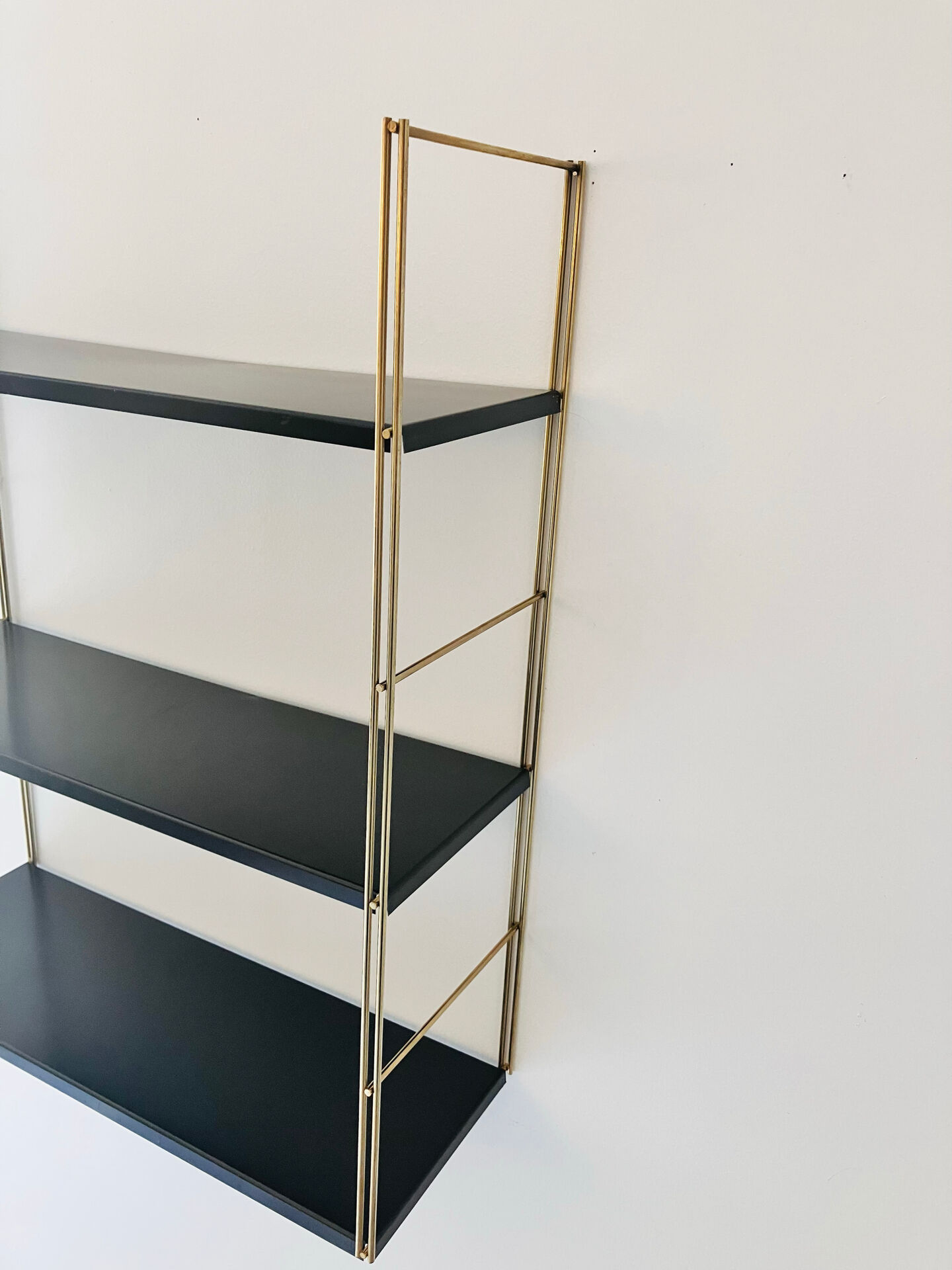 Gold and brown String wall shelves