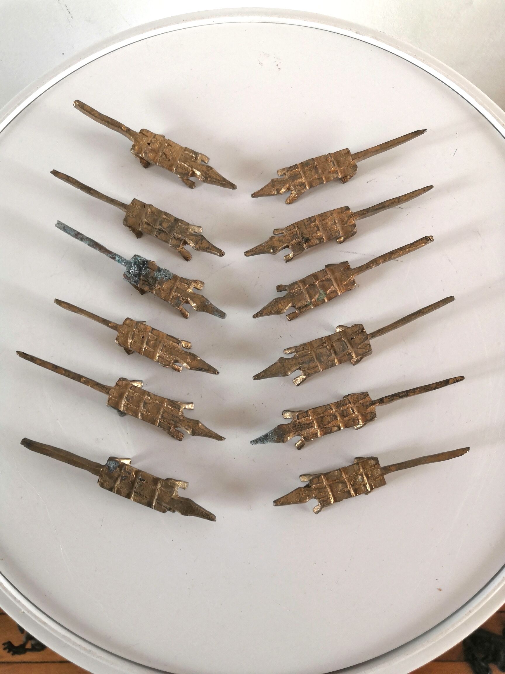 12 vintage bronze knife rests