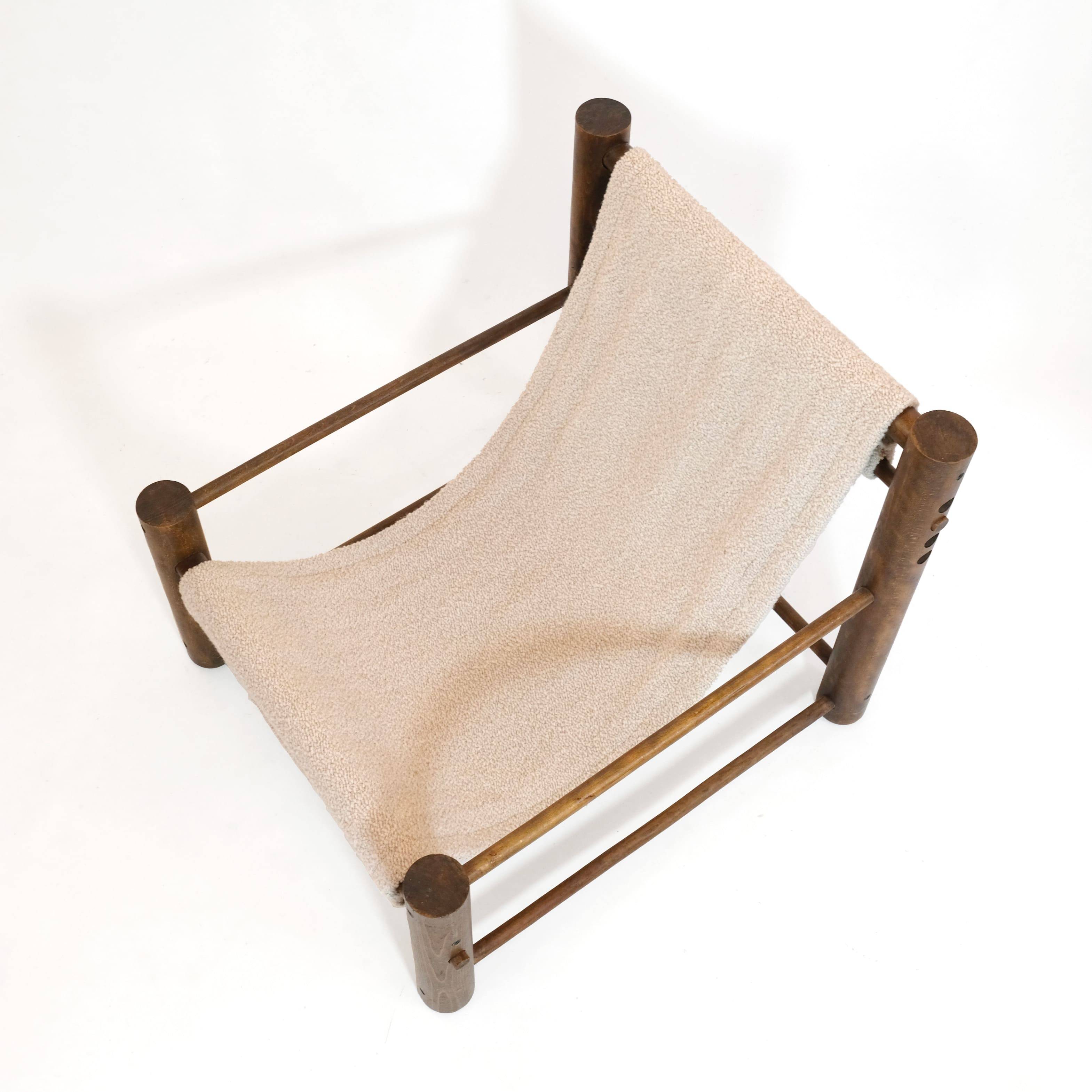Solid wood armchair with adjustable backrest.