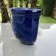 Wall pot in glazed blue terracotta with a grape design, 1970s.