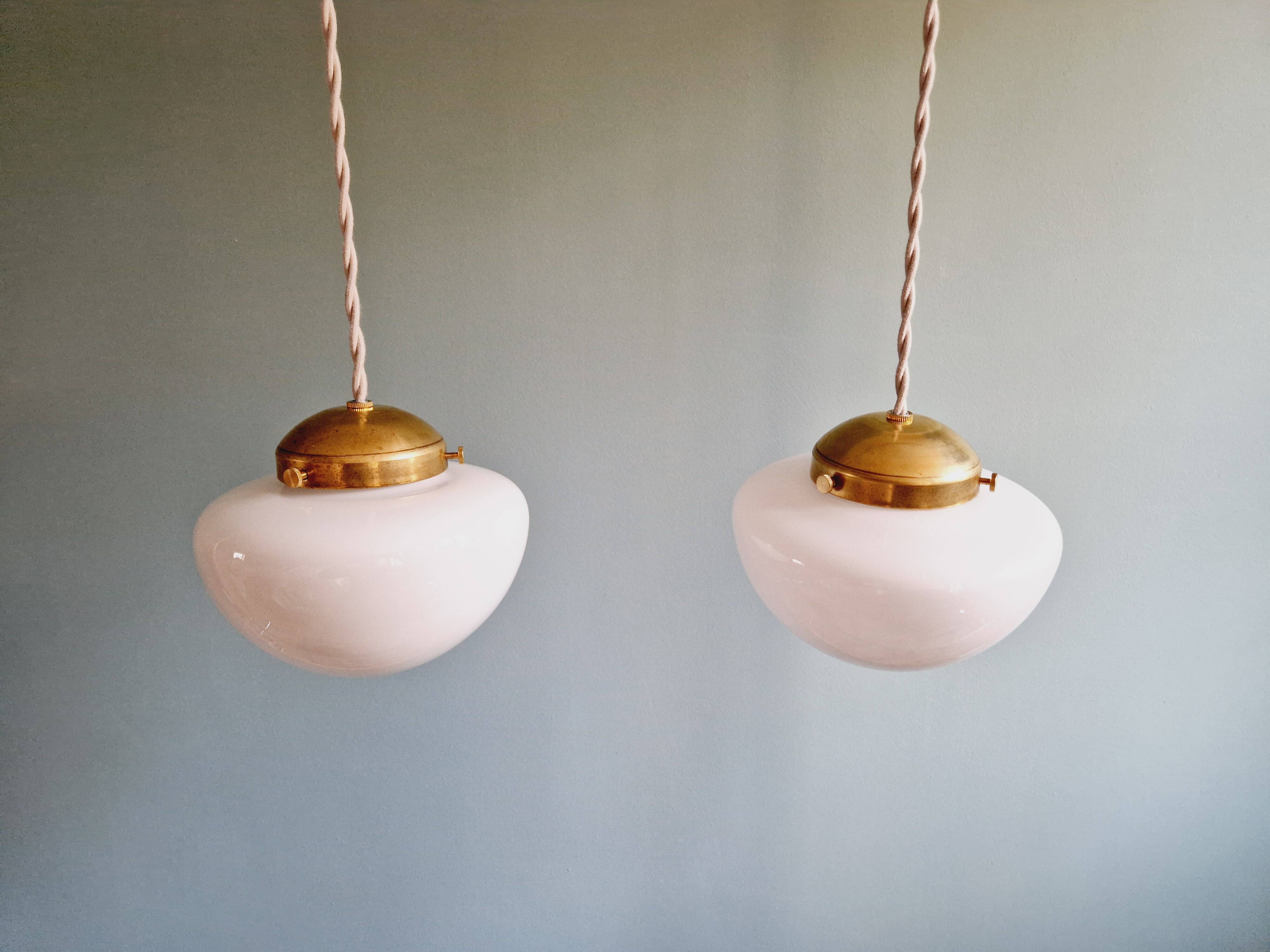 Duo of Art Deco suspensions in white opaline, 1920s-30s
