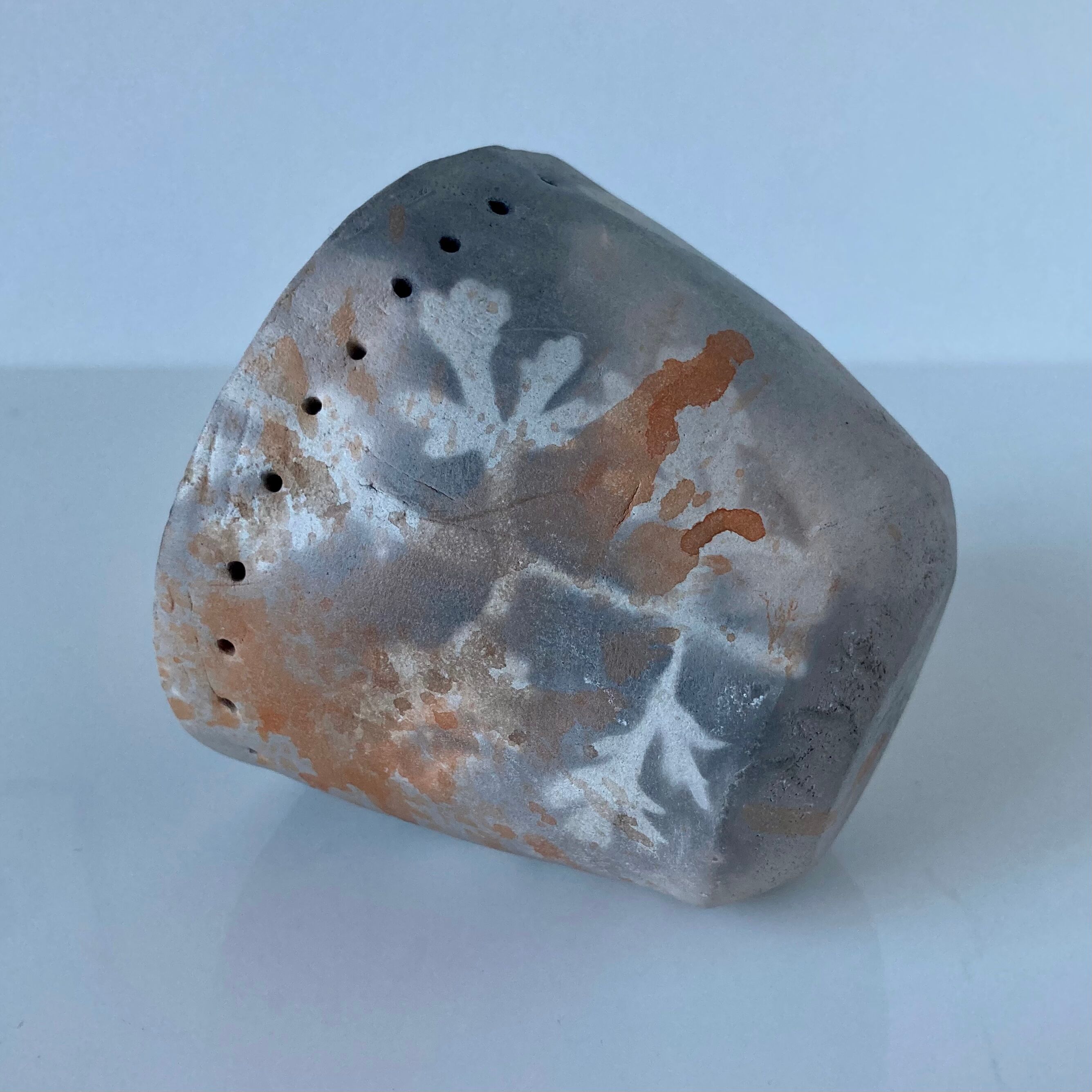 Signed ceramic pot with plant decoration