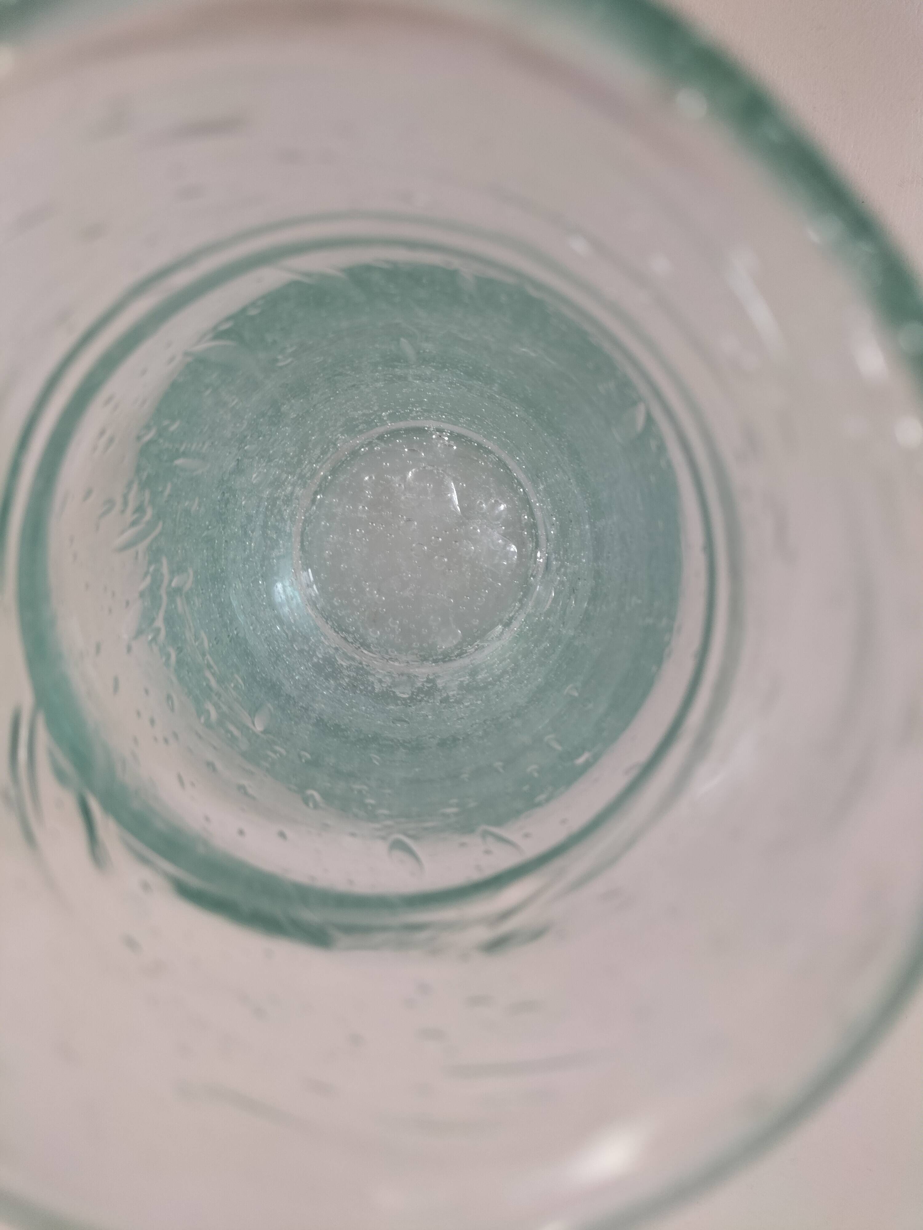 Vintage vase in very pale green bubbled glass, handcrafted