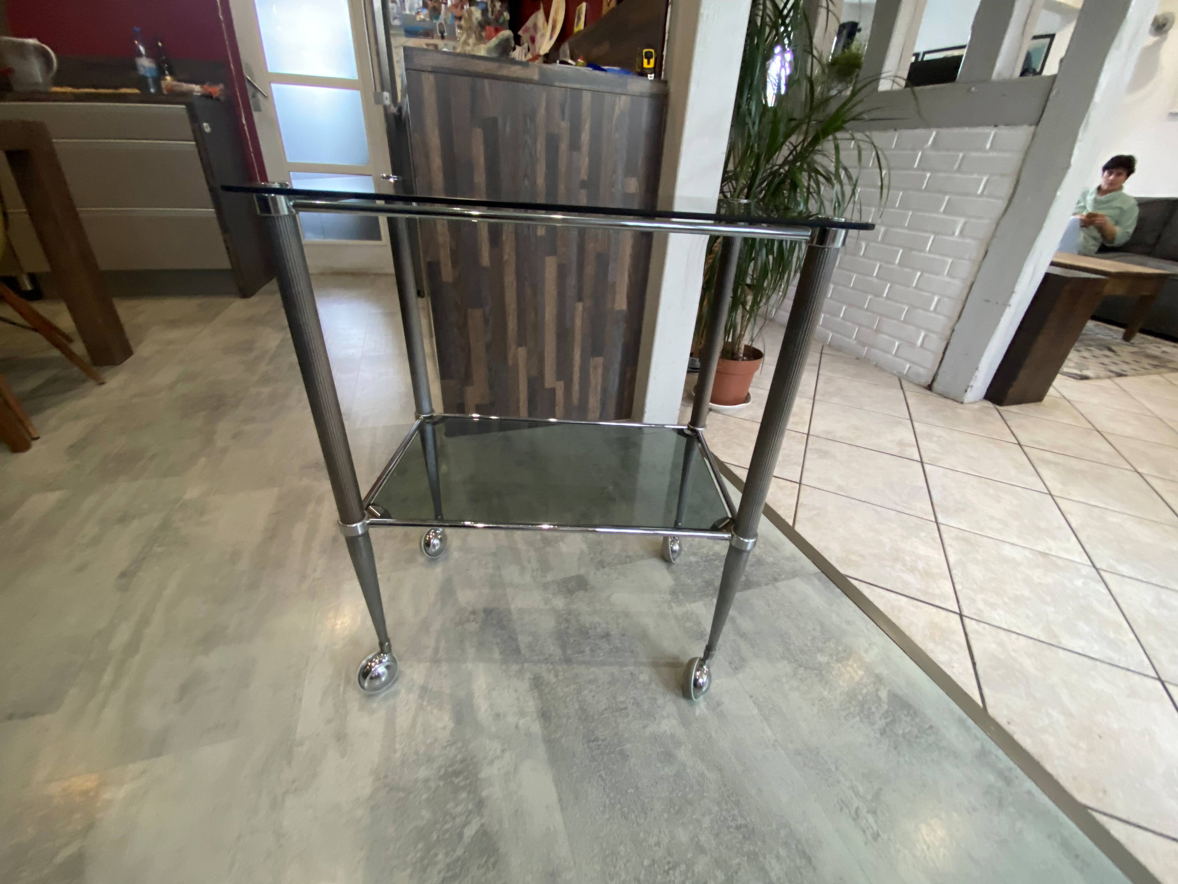 Serving dessert trolley with 2 smoked glass shelves and metal structure.