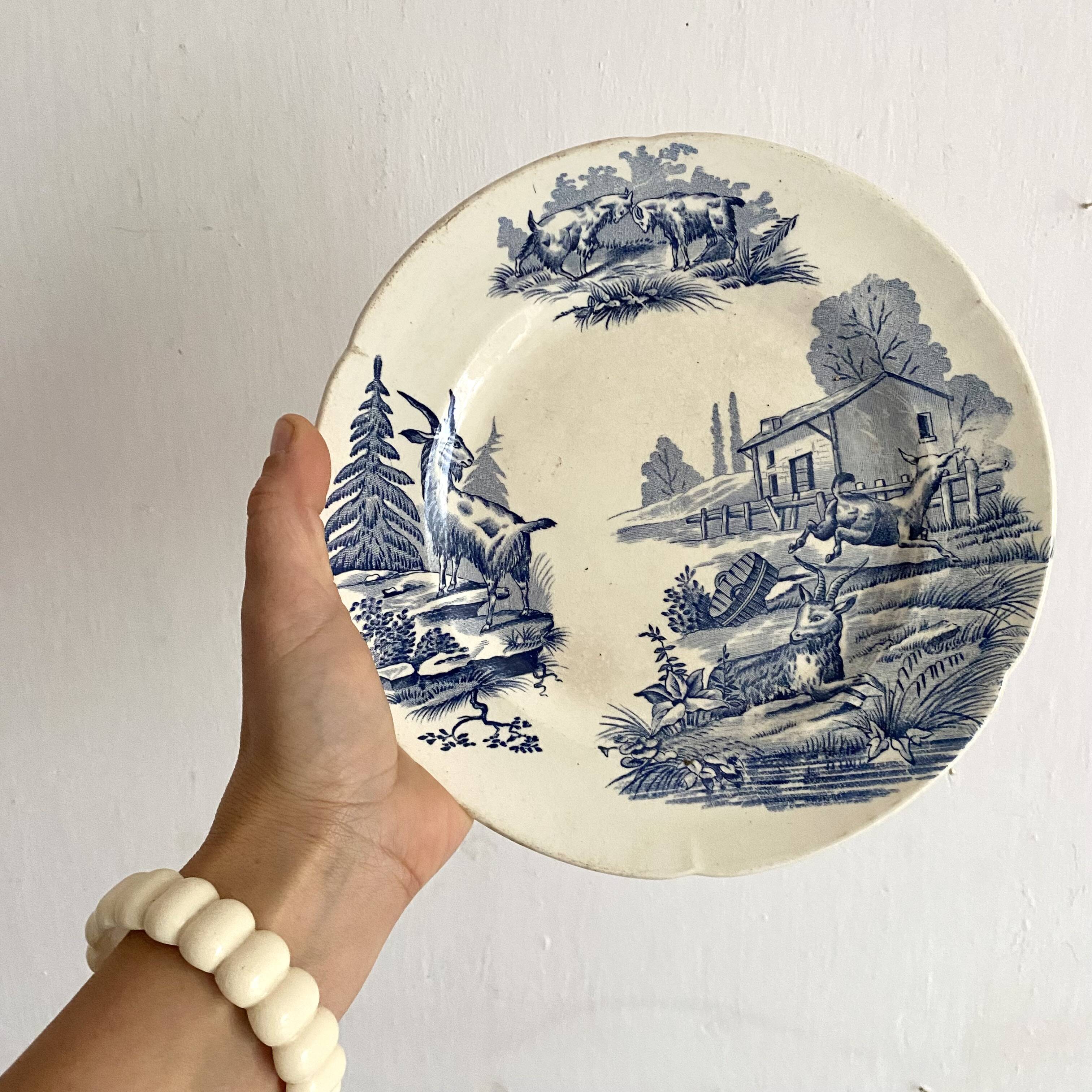 "Rustic" iron earth plate with goats