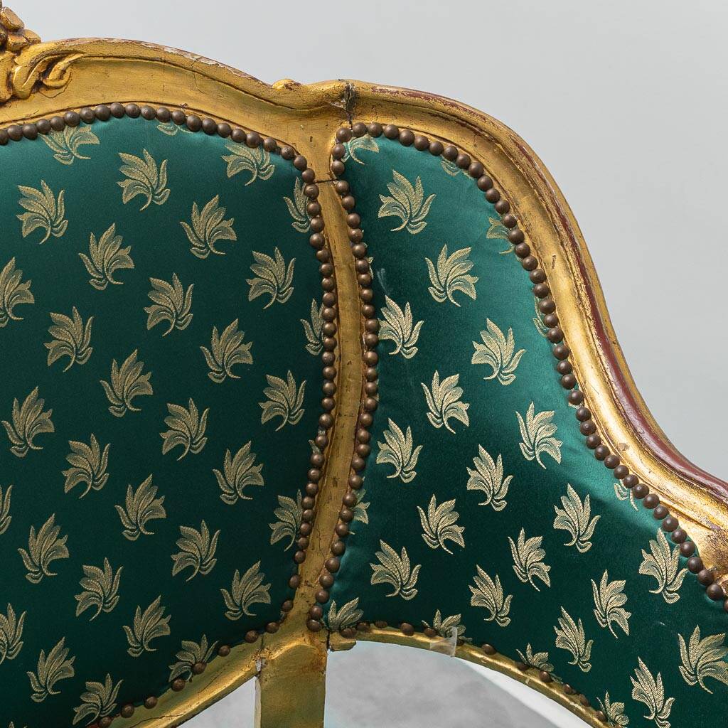 Pair of Louis XV style gilded armchairs with vintage green fabric