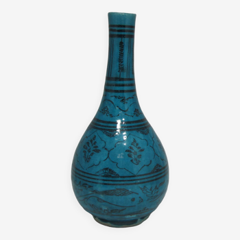 Islamic ceramic vase with turquoise background