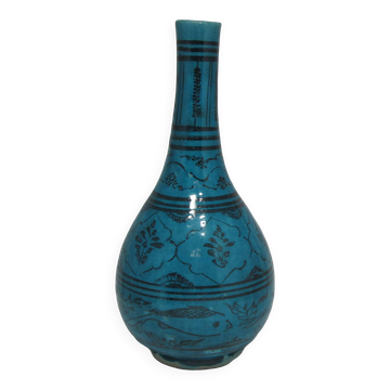 Islamic ceramic vase with turquoise background