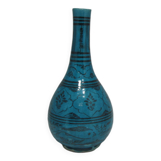 Vase en céramique islamique à fond turquoise