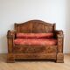 Traditional two-seater bench in solid wood with storage compartment.