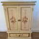 2-door flowered wooden cabinet