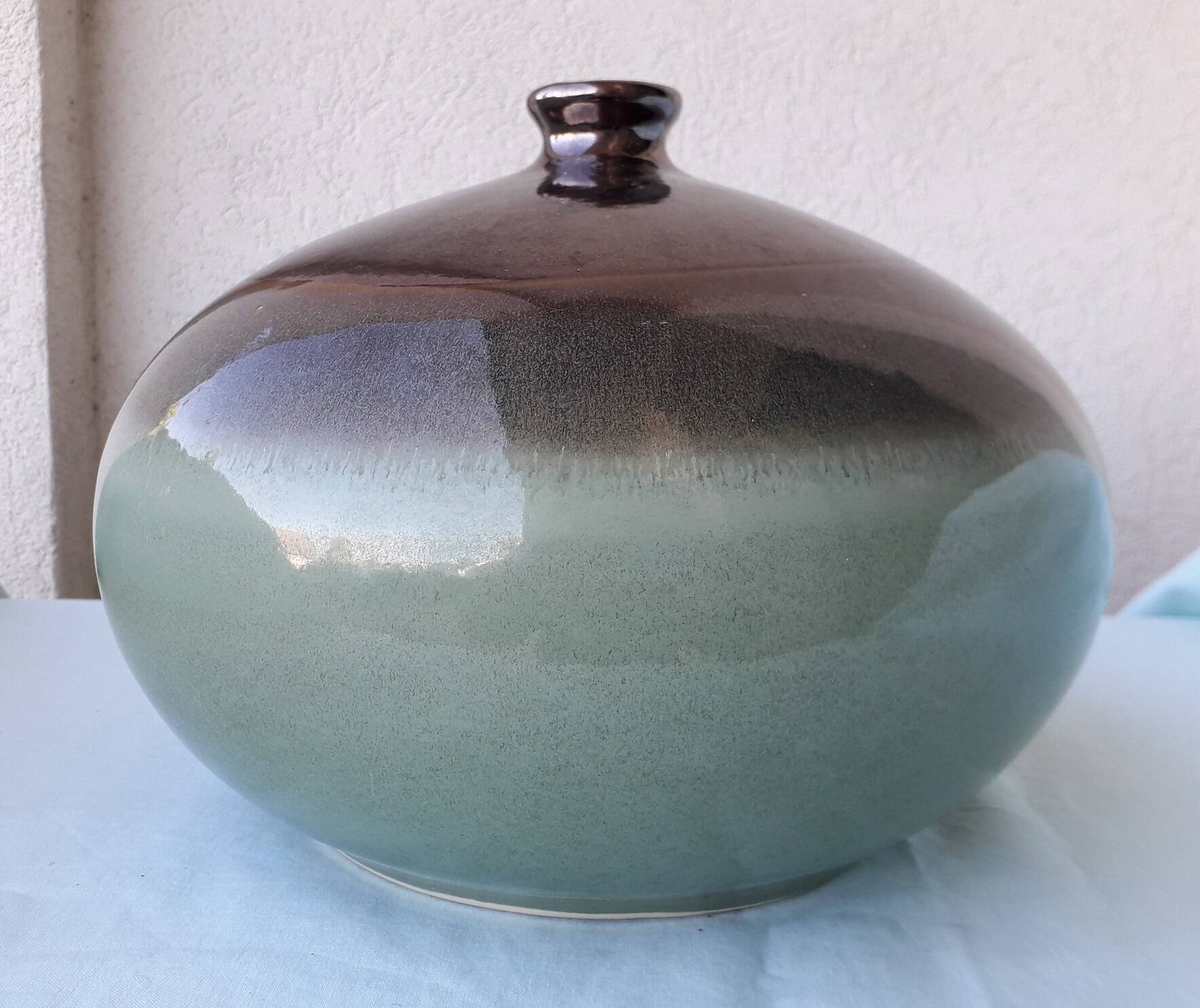 Green and brown ceramic vase